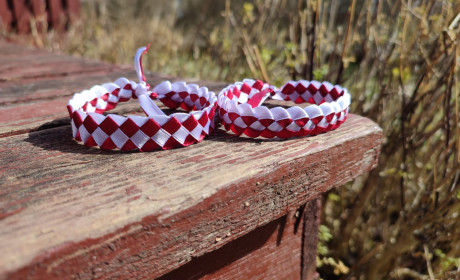 Friendship bracelets in the colours of the Latvian flag